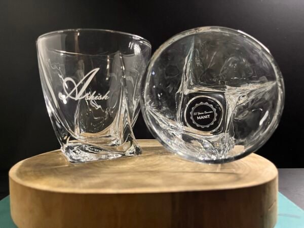 Discover the perfect blend of elegance and personalization with our Personalized Engraved Whiskey Glasses, available online in India. Each glass is meticulously crafted from high-quality, lead-free glass and can be customized with a name monogram, love symbol, and photo engraving, making it an ideal gift for any occasion or a unique addition to your home bar.