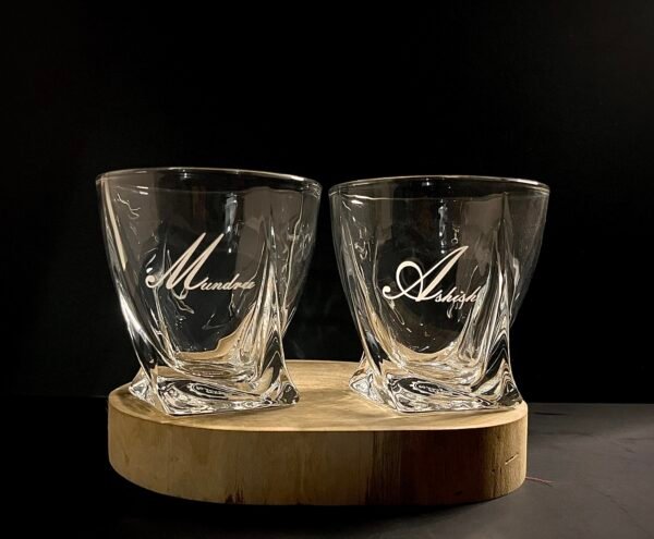 Discover the perfect blend of elegance and personalization with our Personalized Engraved Whiskey Glasses, available online in India. Each glass is meticulously crafted from high-quality, lead-free glass and can be customized with a name monogram, love symbol, and photo engraving, making it an ideal gift for any occasion or a unique addition to your home bar.