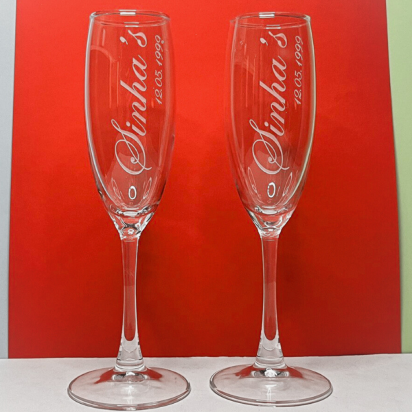 Celebrate in style with our Personalized Champagne Flutes, meticulously crafted to add a touch of elegance to any occasion. These premium champagne glasses are deep engraved to perfection, offering a sophisticated way to enjoy your favorite bubbly.
